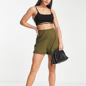 New ASOS DESIGN Tall crinkle shorts in cotton with ruffle hem in khaki size 4